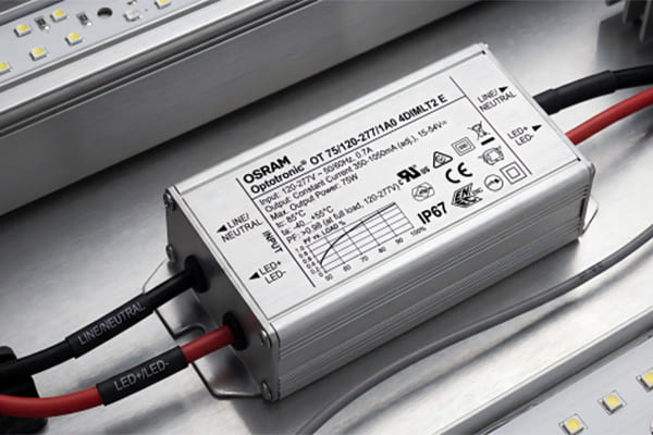 A close-up of a high-quality LED driver showing its power factor (PF) rating